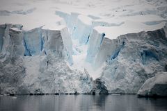 09C Huge Broken Avalanche Glacier Face As It Enters The Water Of Paradise Harbour From Zodiac On Quark Expeditions Antarctica Cruise.jpg